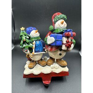 Snowmen Stocking Hanger Cast Iron Base Holding Packages and Tree